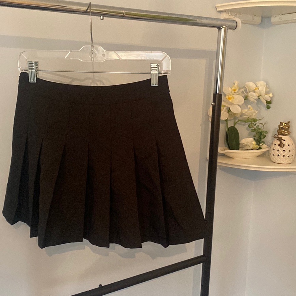 Pleated black mini skirt